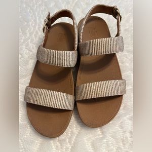 Gold glitter striped FITFLOP sandals.